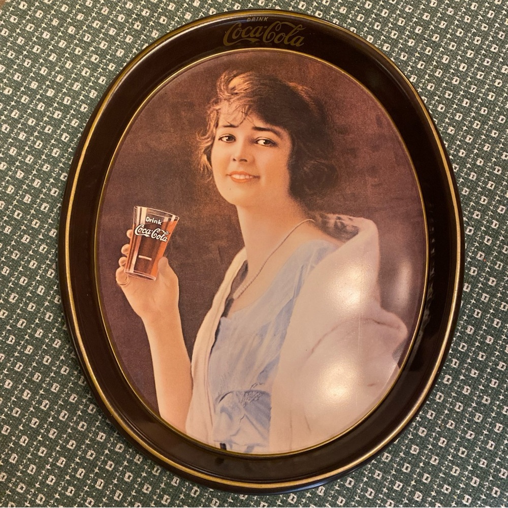 Coca-Cola Classic Oval Tin Sign with Red and White Accents vintage